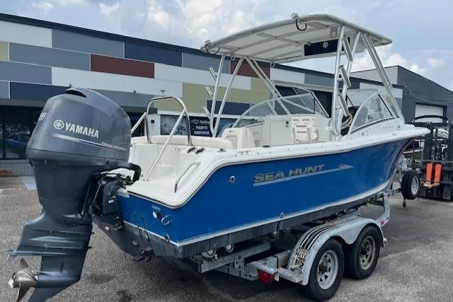 Slide: The Image of 2013 Sea Hunt Escape 211 LE boat with Yamaha engine on trailer. - 2