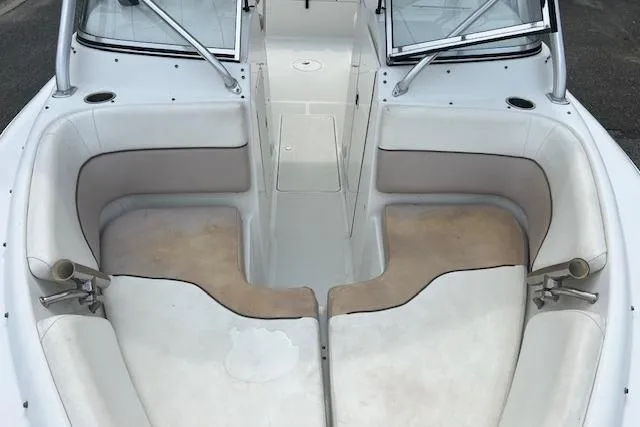 Slide: The Image of 2013 Sea Hunt Escape 211 LE boat interior with cushioned seating and open deck layout. - 8