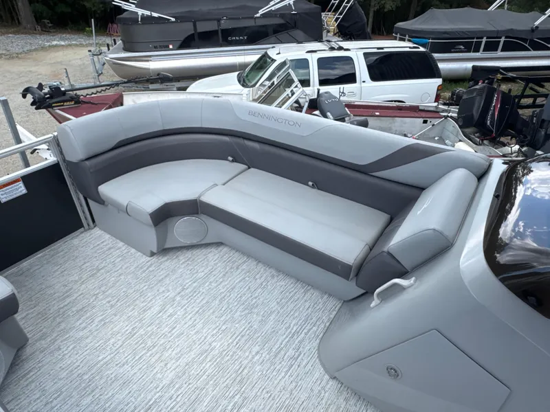 Slide: The Image of 2023 Bennington 22SX Swingback boat interior with gray seating and modern design. - 15