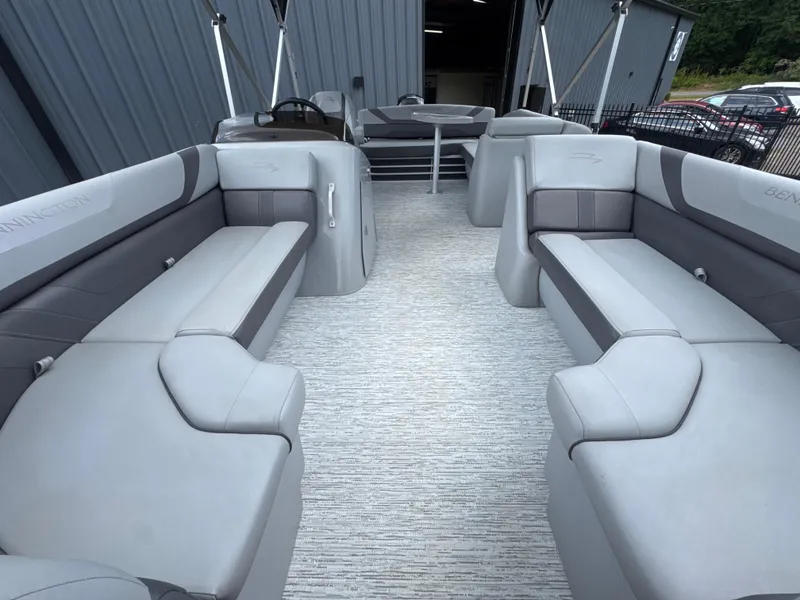 Slide: The Image of 2023 Bennington 22SX SWINGBACK pontoon boat interior with gray seating and modern design. - 16