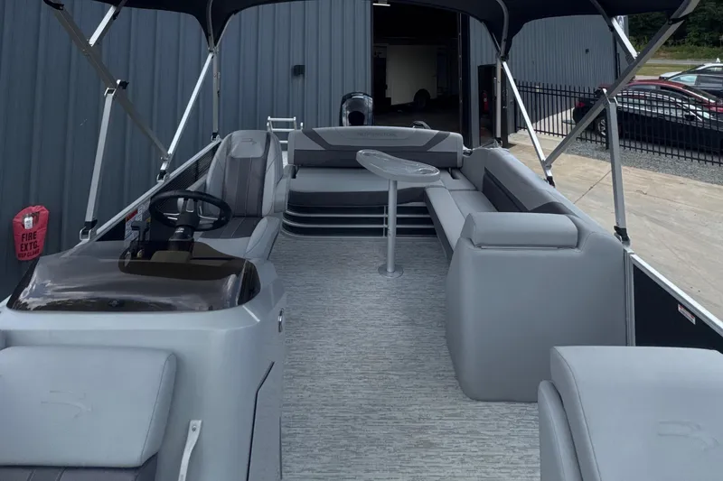 Slide: The Image of 2023 Bennington 22SX SWINGBACK pontoon boat with spacious seating and modern design. - 17