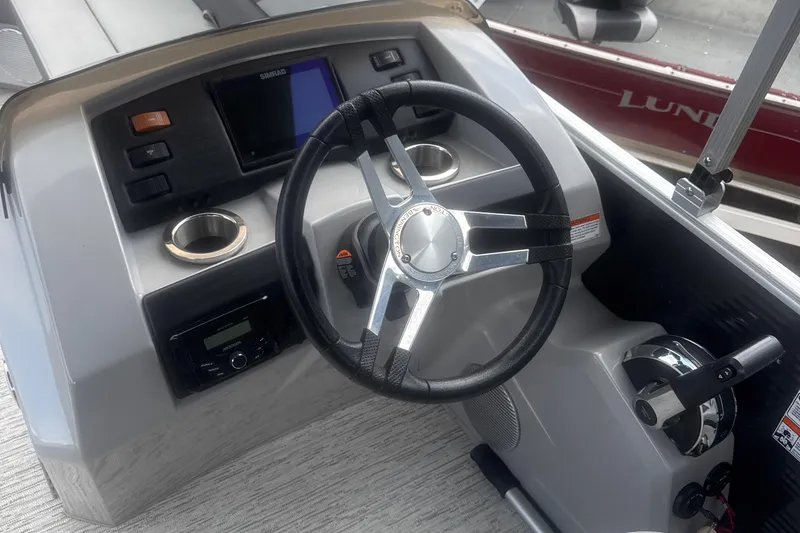 Slide: The Image of Steering console of 2023 Bennington 22SX Swingback boat with modern controls and display. - 19