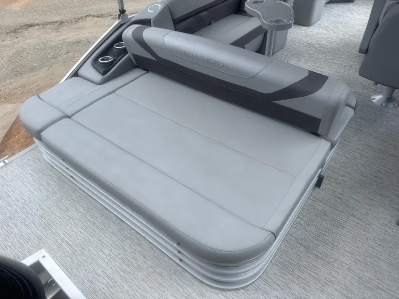 Slide: The Image of 2023 Bennington 22SX Swingback boat with gray cushioned seating and cup holders. - 24