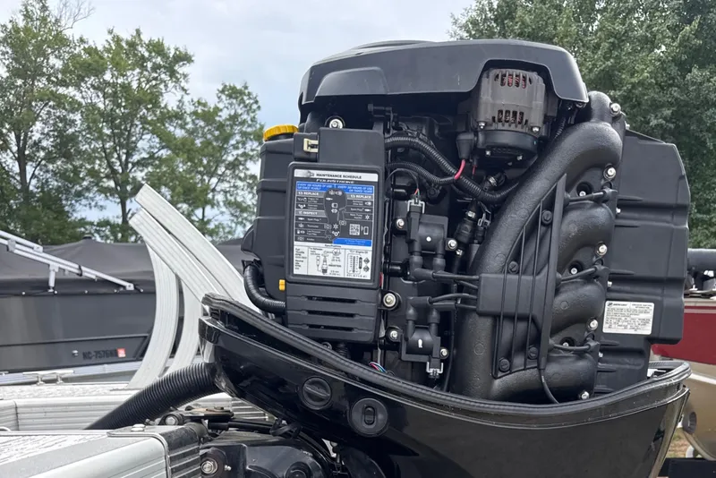 Slide: The Image of Close-up of a 2023 Bennington 22SX SWINGBACK boat engine, showcasing intricate details. - 27