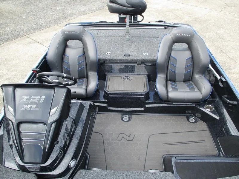 Slide: The Image of 2023 Nitro Z21 XL Pro boat interior with dual seats and steering wheel. - 10