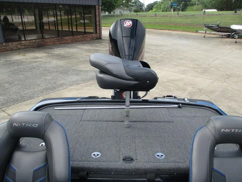 Slide: The Image of 2023 Nitro Z21 XL Pro boat with seating and motor, parked outdoors. - 7