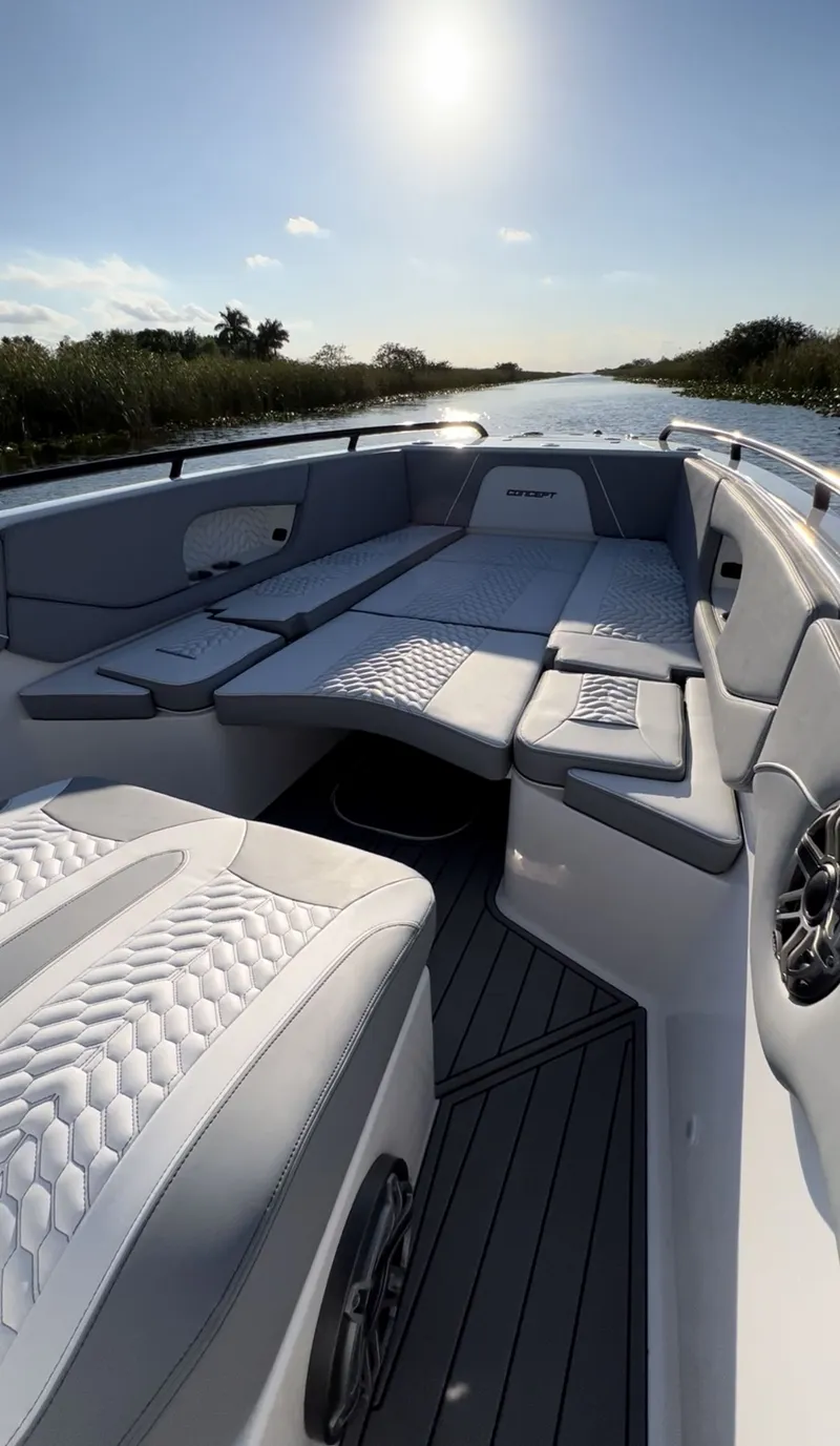 Slide: The Image of 2023 Concept 32' CC boat interior with luxurious seating and scenic waterway view. - 2