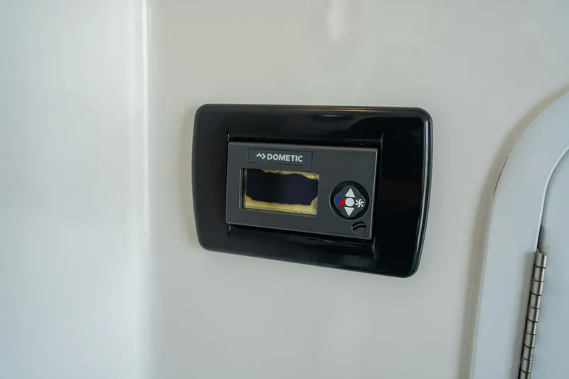 Slide: The Image of Dometic control panel on 2019 Regulator 34 Center Console boat interior. - 15
