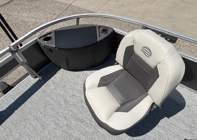 Slide: The Image of 2026 Sun Tracker Bass Buggy 18 DLX boat seat with console and cup holders. - 11