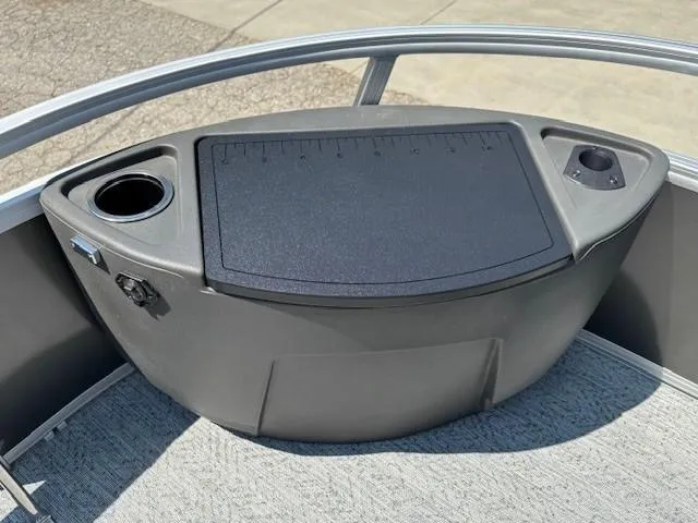 Slide: The Image of 2026 Sun Tracker Bass Buggy 18 DLX boat console with cup holders and storage. - 15