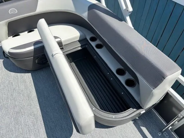 Slide: The Image of 2026 Sun Tracker Bass Buggy 18 DLX boat seating with storage and cup holders. - 21