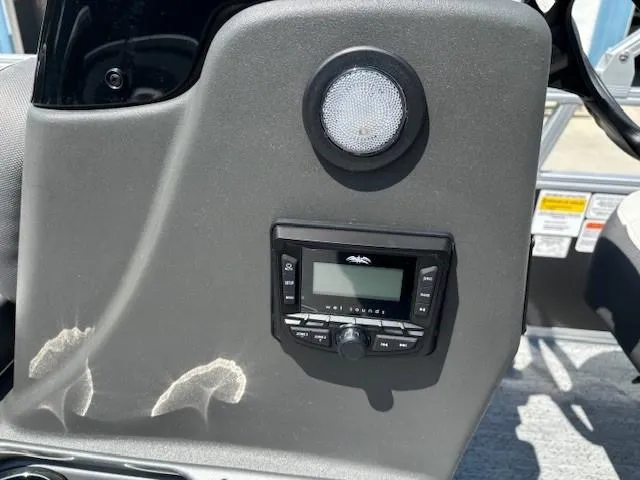 Slide: The Image of Control panel of 2026 Sun Tracker Bass Buggy 18 DLX with speaker and display. - 25