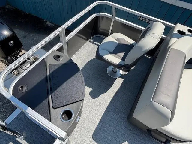 Slide: The Image of 2026 Sun Tracker Bass Buggy 18 DLX interior with seating and fishing station. - 28