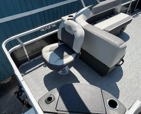 Slide: The Image of 2026 Sun Tracker Bass Buggy 18 DLX pontoon boat interior with seating and deck details. - 30