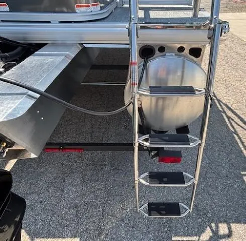 Slide: The Image of 2026 Sun Tracker Bass Buggy 18 DLX pontoon boat ladder and fuel tank. - 4