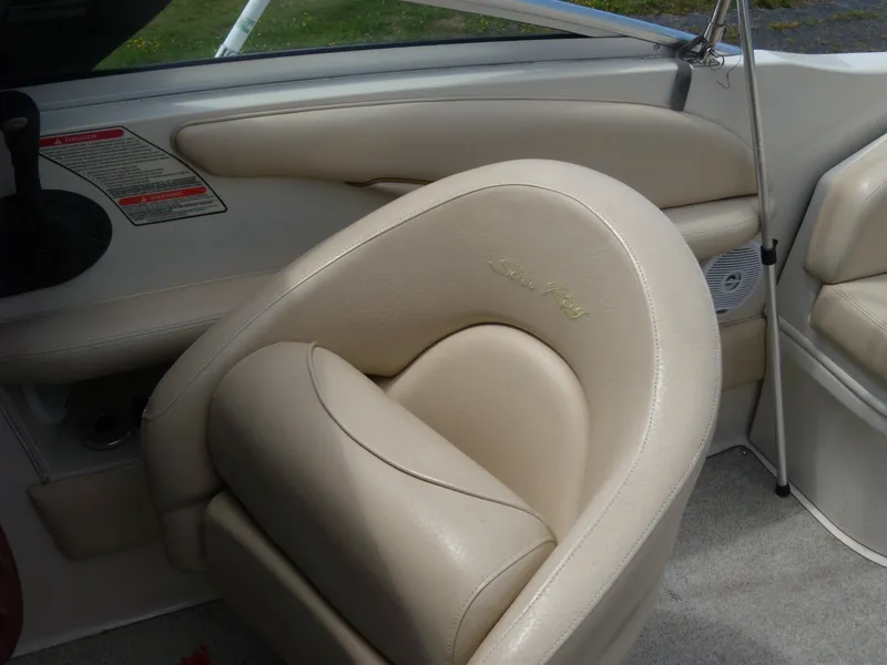 Slide: The Image of 2001 Sea Ray 260 Bow Rider Select interior with beige leather seating. - 10