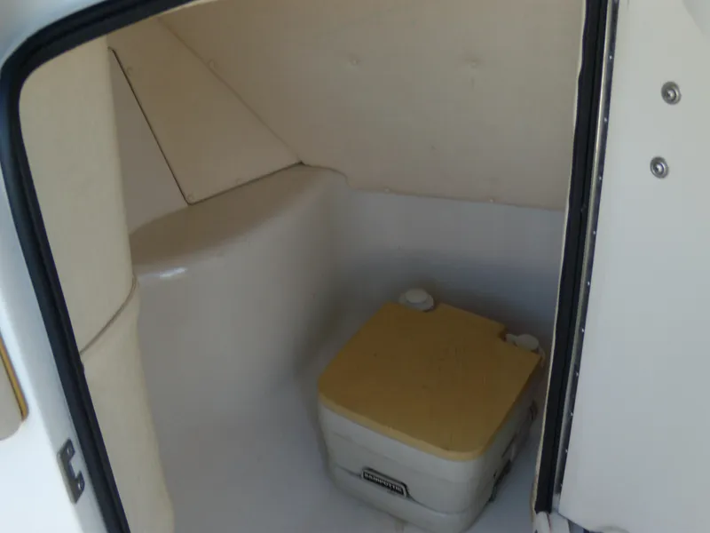 Slide: The Image of 2001 Sea Ray 260 Bow Rider Select interior with portable toilet. - 13