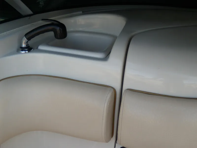 Slide: The Image of Interior of 2001 Sea Ray 260 Bow Rider Select with sink and seating. - 14