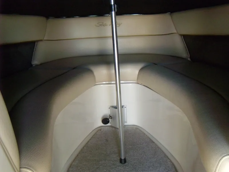 Slide: The Image of Interior of 2001 Sea Ray 260 Bow Rider Select boat with beige seating. - 19