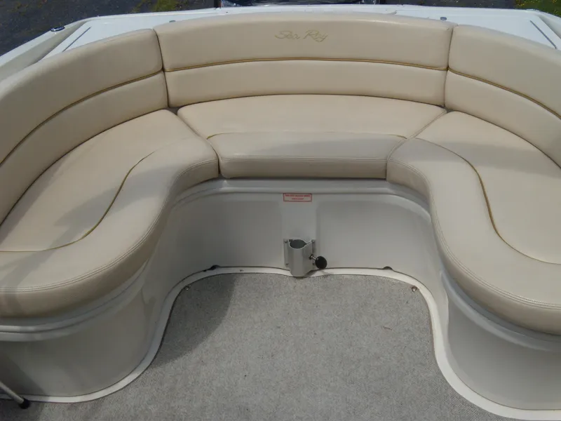 Slide: The Image of 2001 Sea Ray 260 Bow Rider Select boat seating area with beige upholstery. - 9