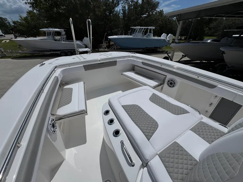 Slide: The Image of 2026 Caymas 30 CT boat interior with cushioned seating and sleek design. - 23