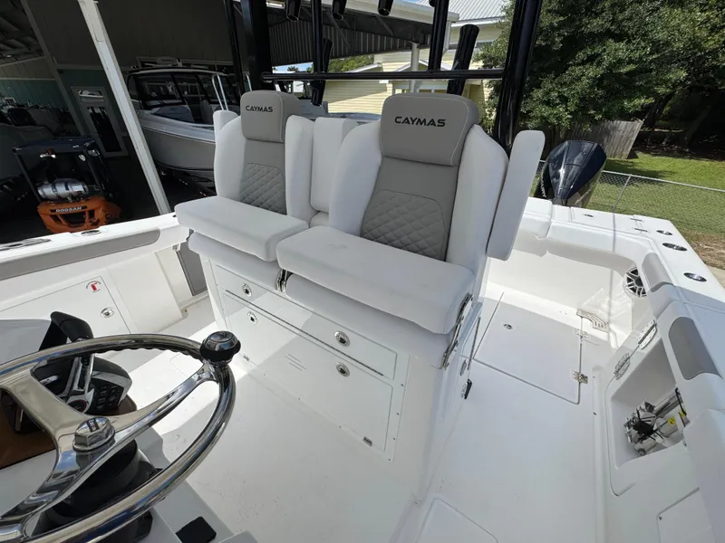 Slide: The Image of 2026 Caymas 30 CT boat interior with dual seats and steering wheel. - 29
