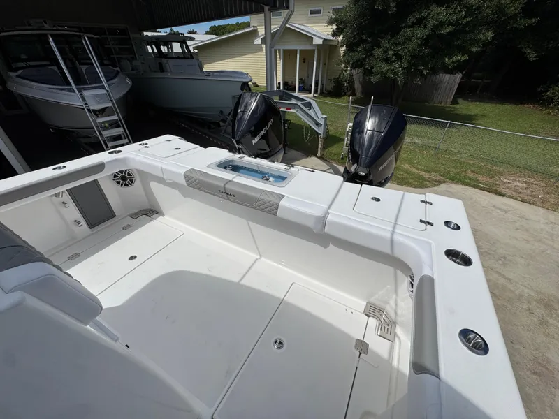 Slide: The Image of 2026 Caymas 30 CT boat interior with dual Mercury engines, spacious deck, and modern features. - 38