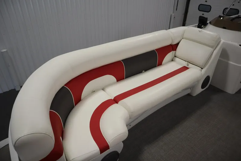 Slide: The Image of Luxurious seating on 2014 JC 22 Limited boat with red, white, and black upholstery. - 16