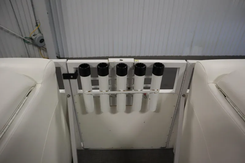 Slide: The Image of Rod holders on a 2014 JC 22 Limited boat, featuring white seating and interior. - 20