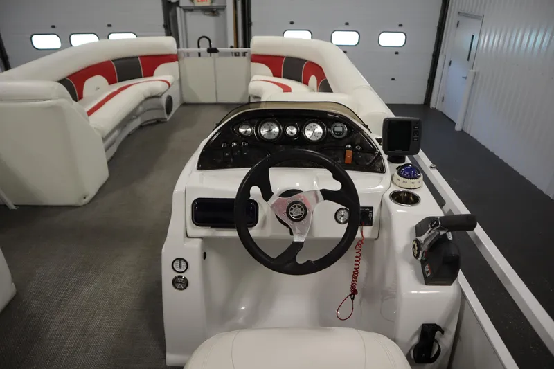 Slide: The Image of Interior of 2014 JC 22 Limited pontoon boat with steering console and seating. - 23