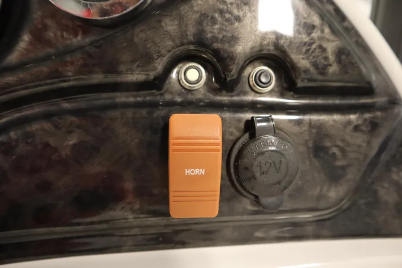 Slide: The Image of Dashboard of 2014 JC 22 Limited with horn button and 12V socket. - 27