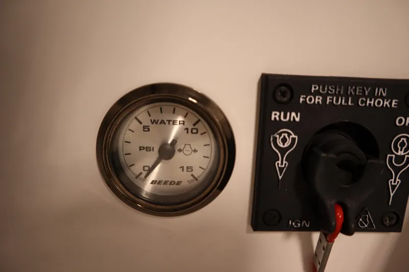 Slide: The Image of Water pressure gauge and ignition switch panel on 2014 JC 22 Limited boat. - 32