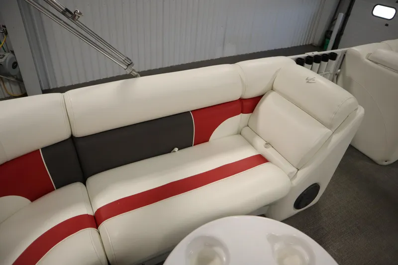 Slide: The Image of 2014 JC 22 Limited boat interior with white, red, and gray seating. - 38