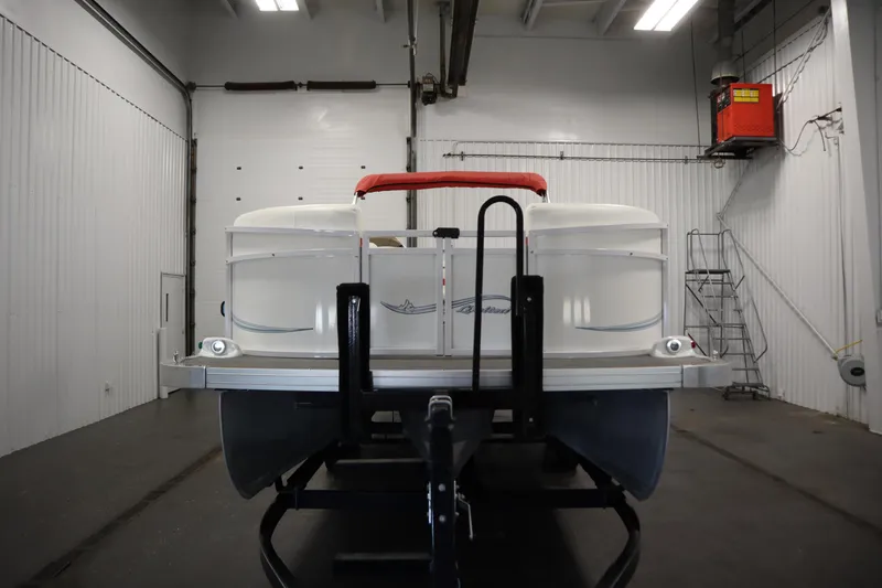 Slide: The Image of 2014 JC 22 Limited pontoon boat in a storage facility. - 1