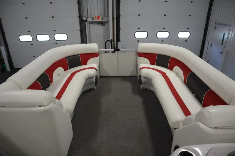 Slide: The Image of Luxurious interior of 2014 JC 22 Limited pontoon boat with red and white seating. - 10
