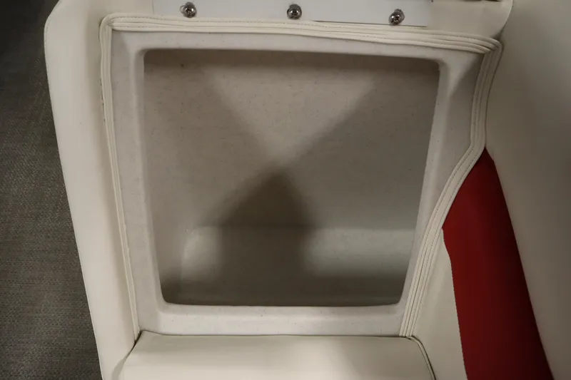 Slide: The Image of Storage compartment in 2014 JC 22 Limited boat with white and red upholstery. - 12