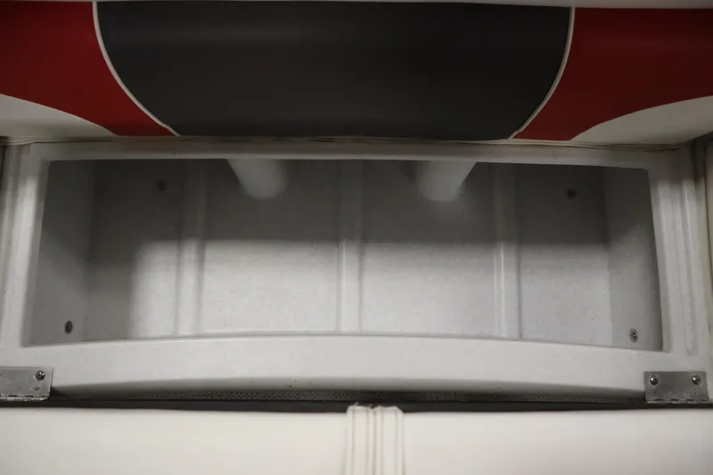 Slide: The Image of Storage compartment in a 2014 JC 22 Limited boat, featuring a spacious interior. - 18