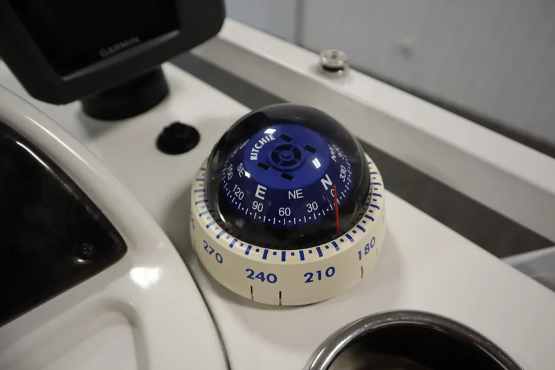 Slide: The Image of Boat compass on JC 22 Limited 2014 dashboard, featuring Ritchie navigation. - 29