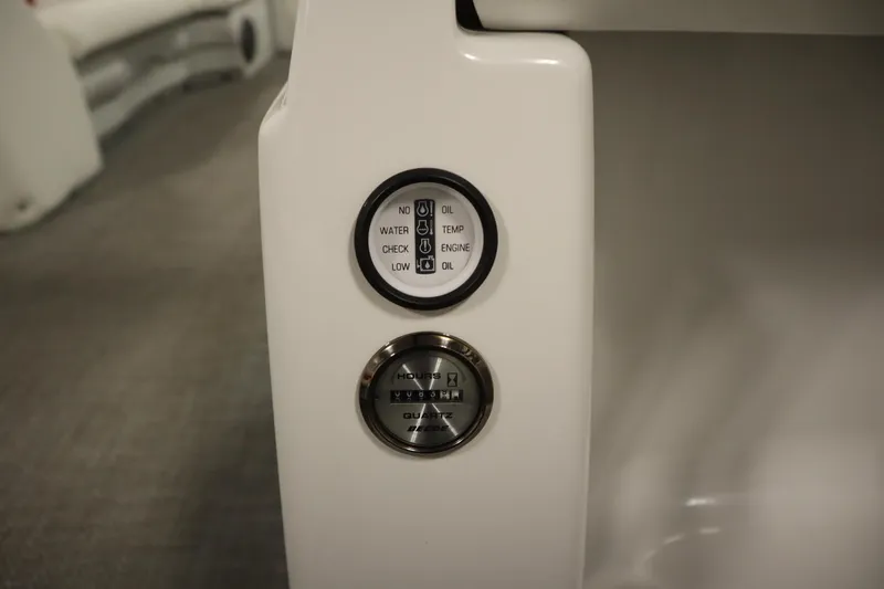 Slide: The Image of Control panel of a 2014 JC 22 Limited boat, displaying engine indicators. - 33