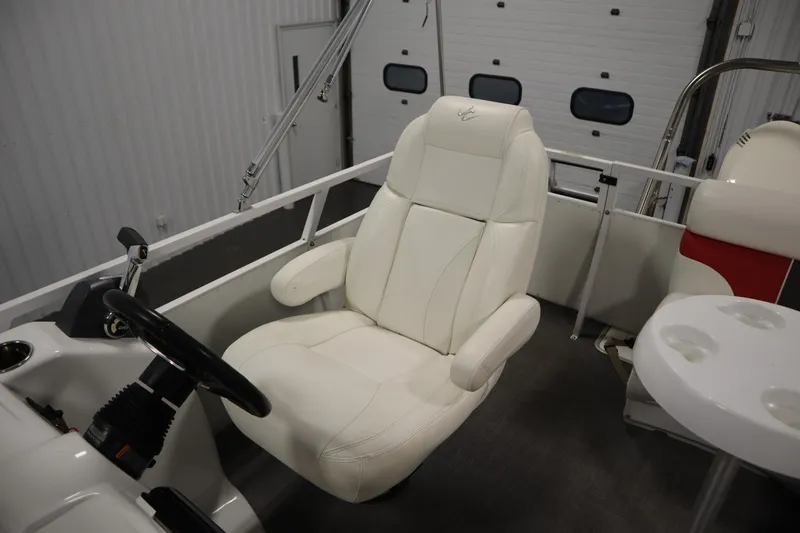 Slide: The Image of White captain's chair in a 2014 JC 22 Limited boat interior. - 36