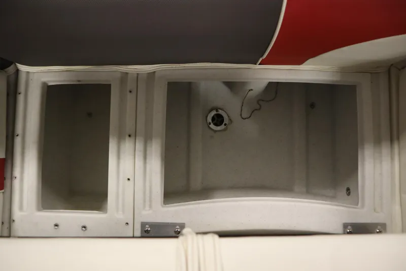 Slide: The Image of 2014 JC 22 Limited boat storage compartments with drain plug. - 40