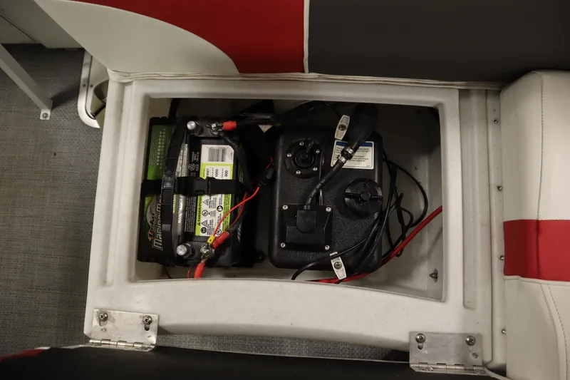 Slide: The Image of Battery compartment of a 2014 JC 22 Limited boat, featuring wiring and connections. - 43
