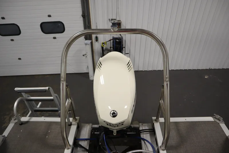 Slide: The Image of 2014 JC 22 Limited boat with outboard motor in a garage setting. - 45
