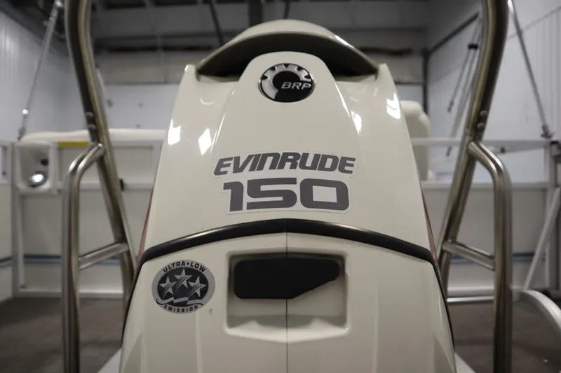 Slide: The Image of 2014 JC 22 Limited boat with Evinrude 150 engine, ultra-low emission badge. - 47