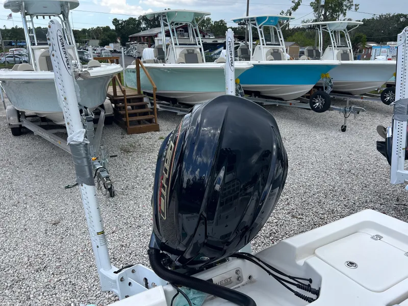 Slide: The Image of 2026 Key West 230 Bay Reef boats on trailers, featuring powerful outboard motors. - 10