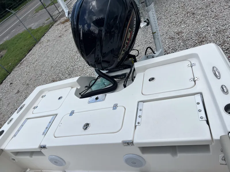 Slide: The Image of 2026 Key West 230 Bay Reef boat with outboard motor, rear deck view. - 13