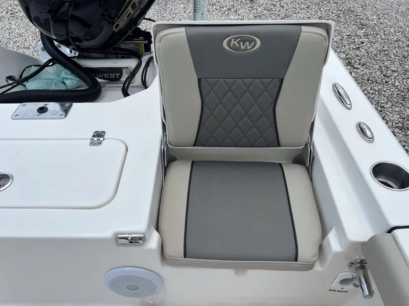 Slide: The Image of 2026 Key West 230 Bay Reef boat seat with gray and beige upholstery. - 15