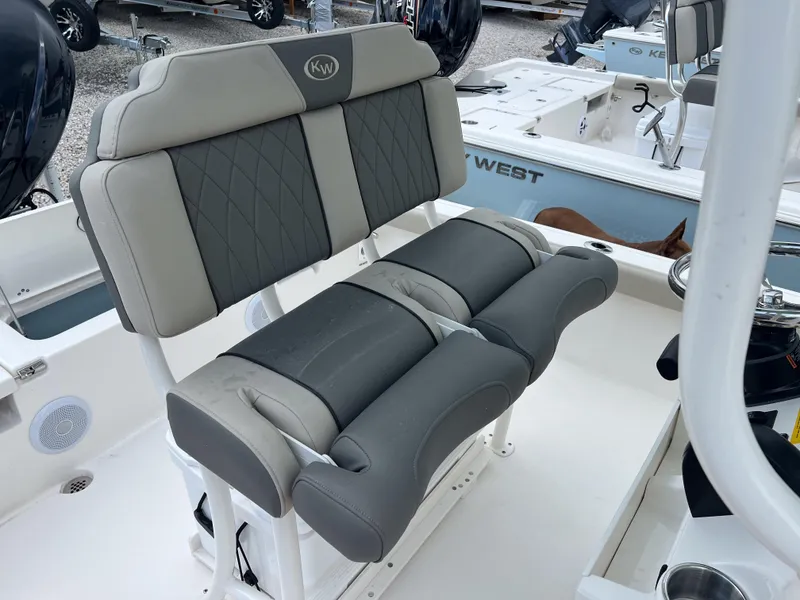 Slide: The Image of 2026 Key West 230 Bay Reef boat with cushioned seating and sleek design. - 8