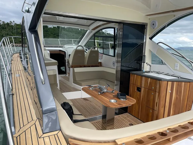 Slide: The Image of Luxurious 2022 Evolve 400HT yacht interior with sleek wood finishes and modern seating. - 10