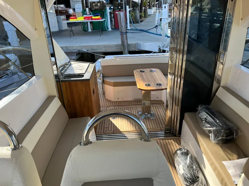 Slide: The Image of Interior of 2022 Evolve 400HT yacht with seating, table, and kitchenette. - 11